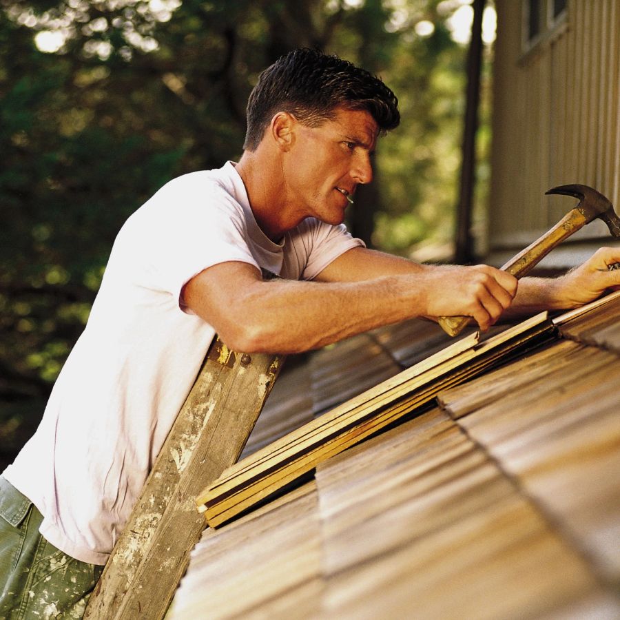 Roofer installing a roof